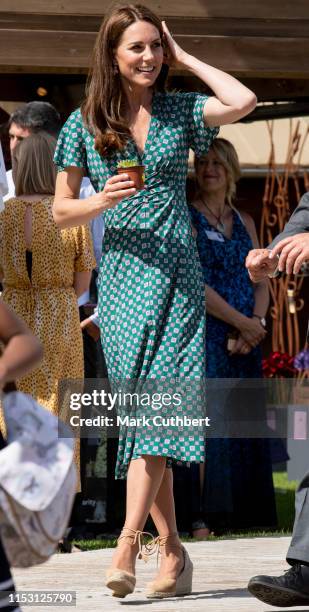 Catherine, Duchess of Cambridge visits The RHS Back to Nature Garden she designed at the 2019 RHS Hampton Court Palace Flower Show at Hampton Court...