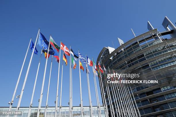 Flags of European Union's countries fly in front of Louise Weiss building , headquarters of the European Parliament in Strasbourg, eastern France, on...