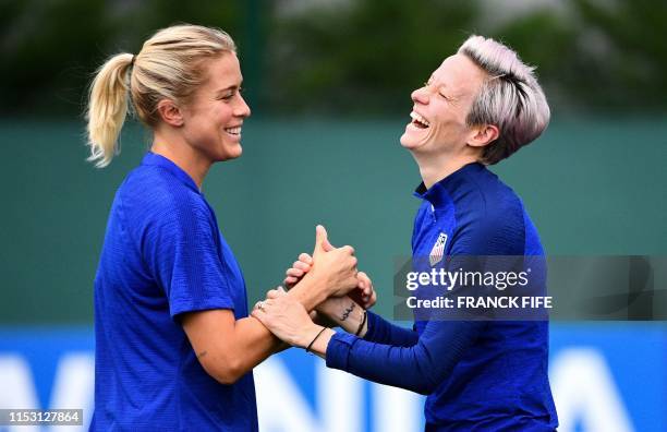 United States' forward Megan Rapinoe faces defender Abby Dahlkemper as they take part in a training session in Lyon, on July 1 during the France 2019...