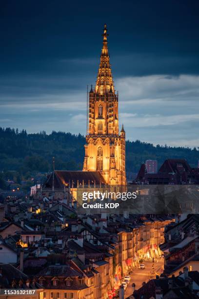 the cathedral of bern, berner münster, illuminating of church, switzerland - bern clock tower stock pictures, royalty-free photos & images