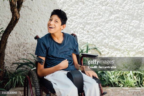 teenager boy with cerebral palsy - teenager cerebral palsy stock pictures, royalty-free photos & images