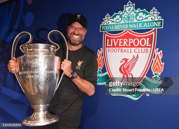 Jurgen Klopp, manager of Liverpool holds the winners trophy after the UEFA Champions League Final between Tottenham Hotspur and Liverpool at Estadio...