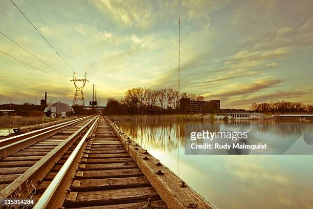 wooden train bridge crossing grand river - grand rapids michigan stock-fotos und bilder