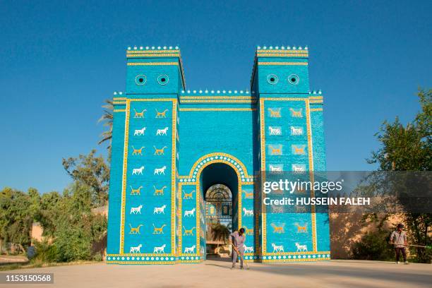 Picture taken on June 29, 2019 shows a replica the Ishtar Gate at the ancient archaeological site of Babylon, south of the Iraqi capital Baghdad. -...