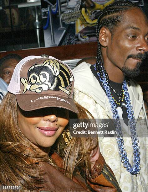 Lil Kim and Snoop Dogg during Snoop Dogg's "Tha Blue Carpet Treatment" Album Preview Party at Strata Night Club in New York City, New York, United...