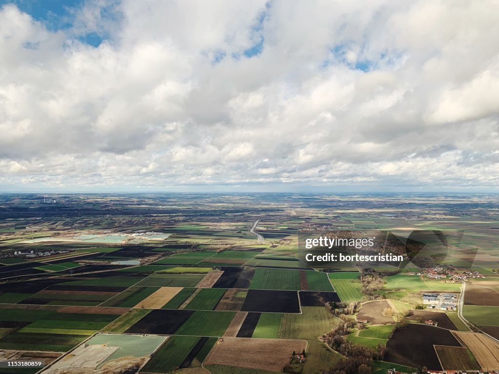 Aerial View Of Agricultural Field Against Sky
