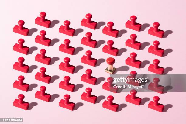 rubber stamps standing out from the crowd - bureaucracy stock pictures, royalty-free photos & images