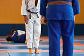 Two judo fighters or athletes greeting each other in a bow before practicing martial arts