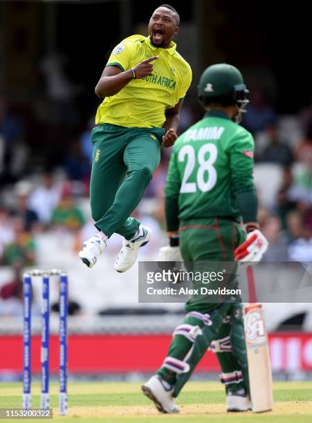 Andile Phehlukwayo of South Africa celebrates taking the wicket of Tamim Iqbal of Bangladesh during the Group Stage match of the ICC Cricket World...
