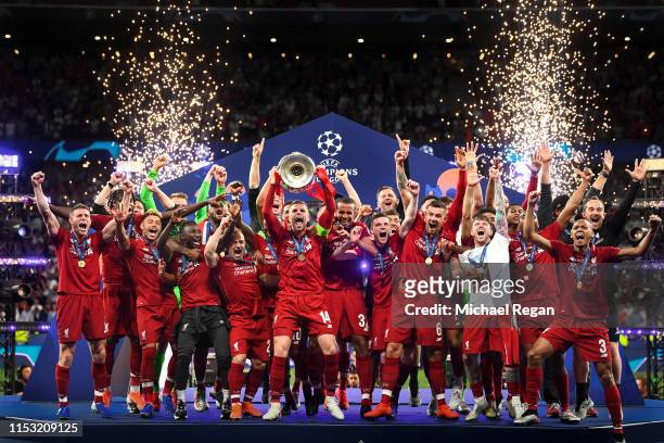 Jordan Henderson of Liverpool lifts the Champions League Trophy after winning the UEFA Champions League Final between Tottenham Hotspur and Liverpool...