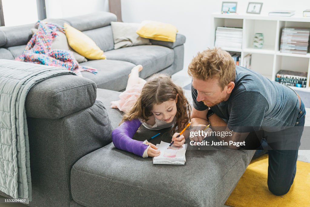 Daddy and daughter - drawing together