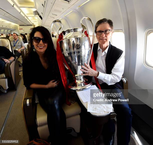 John Henry and Linda Pizzuti Henry owners of Liverpool with the UEFA Champions League trophy during the flight home from winning the UEFA Champions...