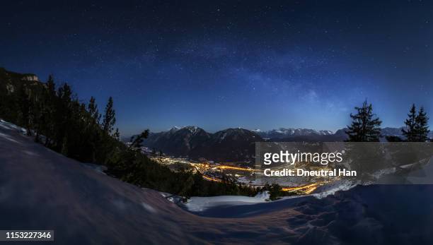garmisch-partenkirchen at night - snowy village stock pictures, royalty-free photos & images