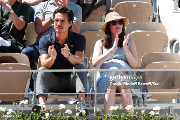 Actor Frederic Chau and his pregnant wife attend the 2019 French Tennis Open - Day Eight at Roland Garros on June 02, 2019 in Paris, France.