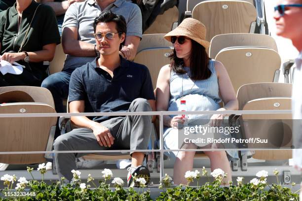 Actor Frederic Chau and his pregnant wife attend the 2019 French Tennis Open - Day Eight at Roland Garros on June 02, 2019 in Paris, France.
