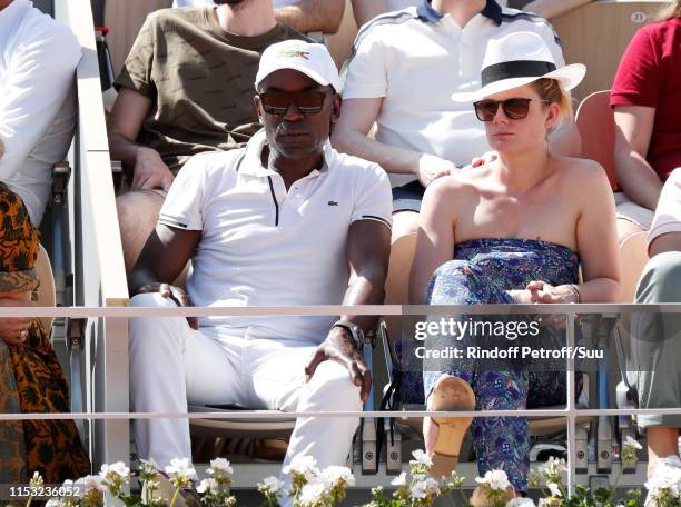 Lucien Jean-Baptiste and Aurelie Nollet attend the 2019 French Tennis Open - Day Eight at Roland Garros on June 02, 2019 in Paris, France.