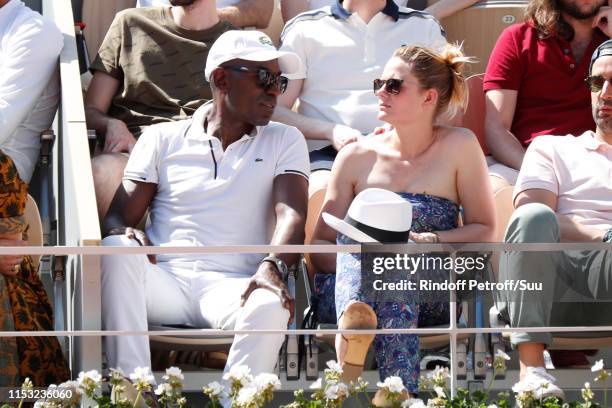 Lucien Jean-Baptiste and Aurelie Nollet attend the 2019 French Tennis Open - Day Eight at Roland Garros on June 02, 2019 in Paris, France.