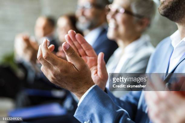 close up of applauding on education event. - applauding stock pictures, royalty-free photos & images