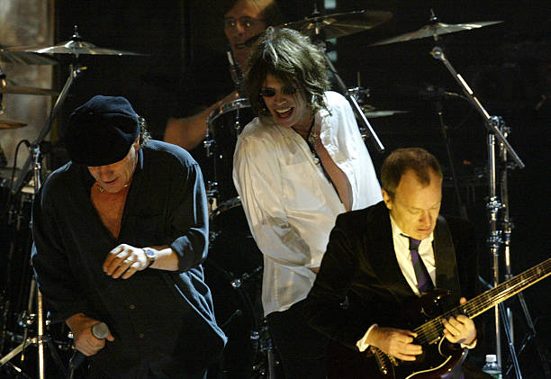Brian Johnson and Angus Young of AC/DC with Steven Tyler