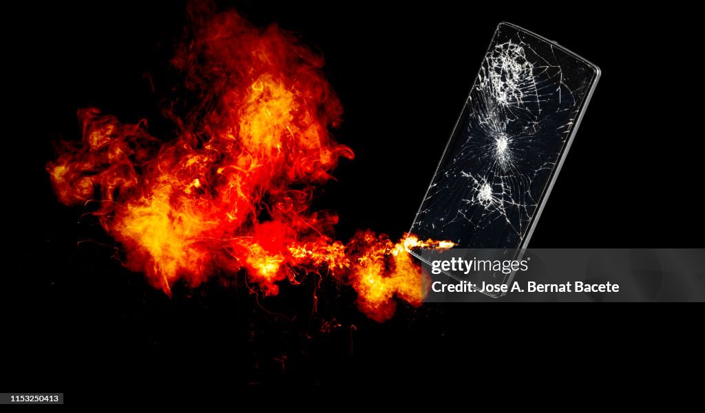 Mobile phone with broken glass exploding.