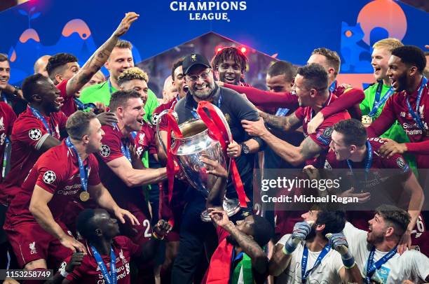 Jurgen Klopp, Manager of Liverpool celebrates with the Champions League Trophy after winning the UEFA Champions League Final between Tottenham...