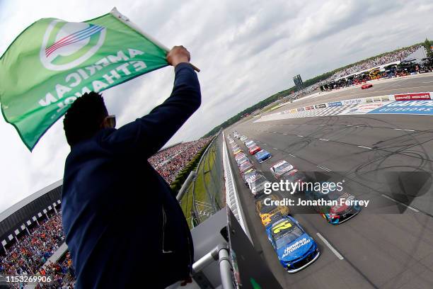 William Byron, driver of the Hendrick Autoguard Chevrolet, and Kyle Busch, driver of the M&M's Hazelnut Toyota, lead the field to the green flag to...