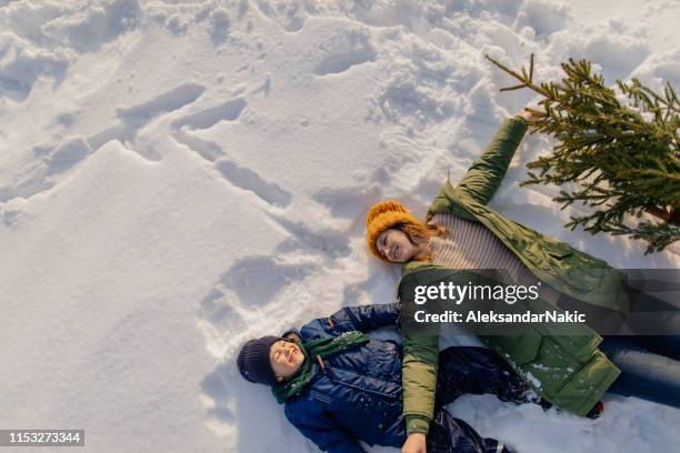 christmas tree for my little family - snow angel stock pictures, royalty-free photos & images