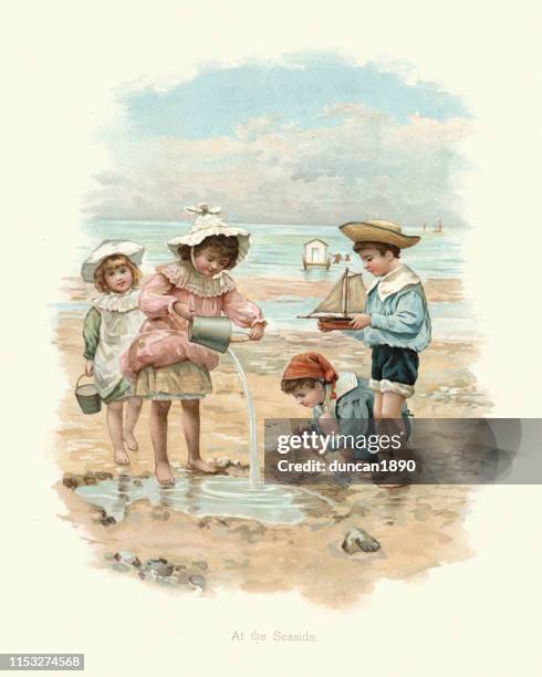 children playing on the beach at the seaside, victorian, 19th century - british coast stock illustrations