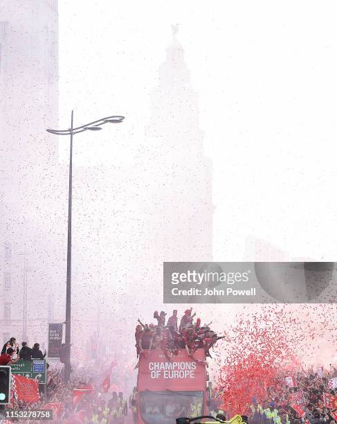 Liverpool's players celebrate on board an open-top bus during the UEFA Champions League victory parade, after winning yesterday's final against...