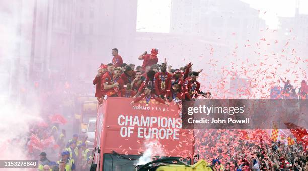 Liverpool's players celebrate on board an open-top bus during the UEFA Champions League victory parade, after winning yesterday's final against...