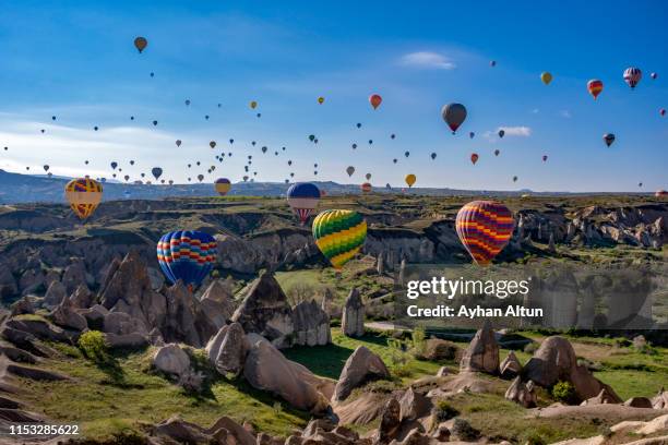 hot air ballooning in cappadocia, nevsehir, central anatolia of turkey - cappadocia stock pictures, royalty-free photos & images