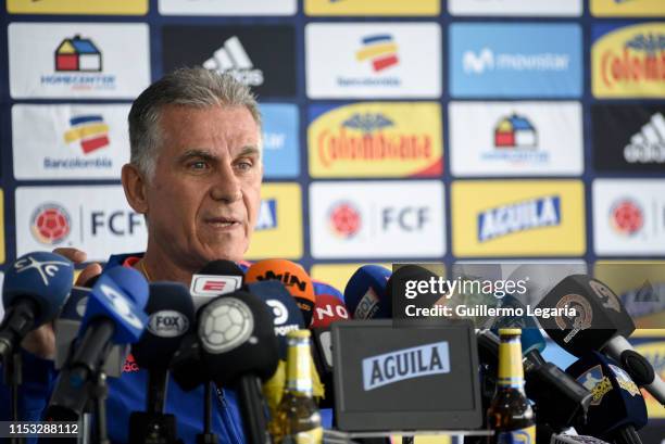 Colombian football team coach Carlos Queiroz speaks during a press conference after a training session at Metropolitano de Techo stadium on June 02,...
