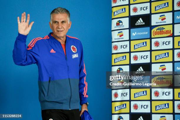 Colombian football team coach Carlos Queiroz waves during a press conference after a training session at Metropolitano de Techo stadium on June 02,...