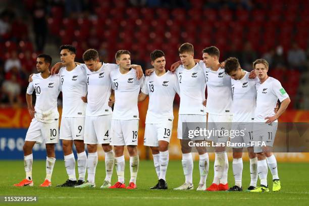 The New Zealand players line up and look on during the penalty shoot out in the 2019 FIFA U-20 World Cup Round of 16 match between Colombia and New...