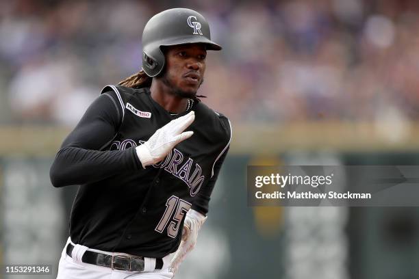 Raimel Tapia of the Colorado Rockies advances to third on a David Dahl double in the second inning against the Toronto Blue Jays at Coors Field on...