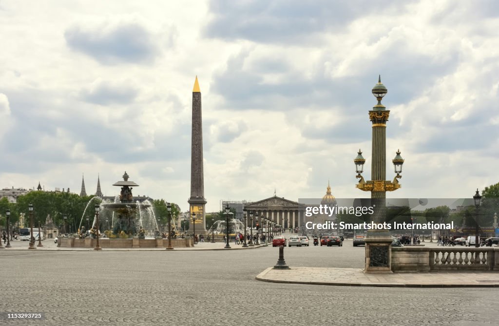 Place de la Concorde with Obelisk of Luxor, National Assembly facade and Hotel des Invalides on the background in Paris, Ile de France, France
