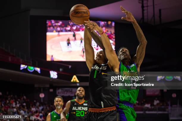 Aliens player Ryan Hollins battles for a rebound with 3 Headed Monsters player Larry Sanders during the BIG3 basketball game between the 3 Headed...