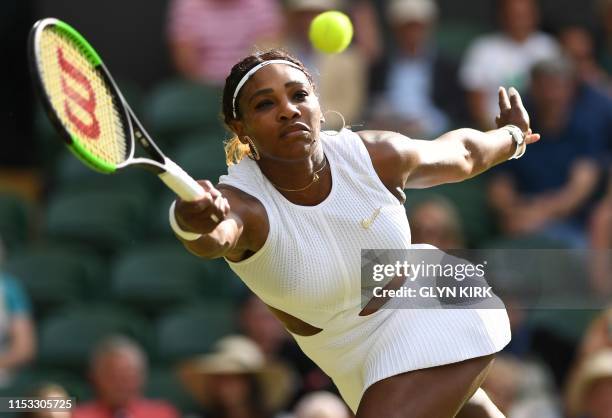 Player Serena Williams returns the ball to Italia's Giulia Gatto-Monticone during their women's singles first round match on the second day of the...