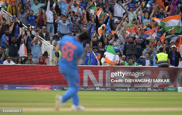 India's Jasprit Bumrah celebrates in front of a cheering crowd after taking the final wicket for victory in the 2019 Cricket World Cup group stage...