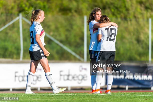 Tuana Shahnis Keles of Germany is comforted by Annika Wohner of Germany and Franziska Gaus of Germany after losing on penalty shots during the U16...