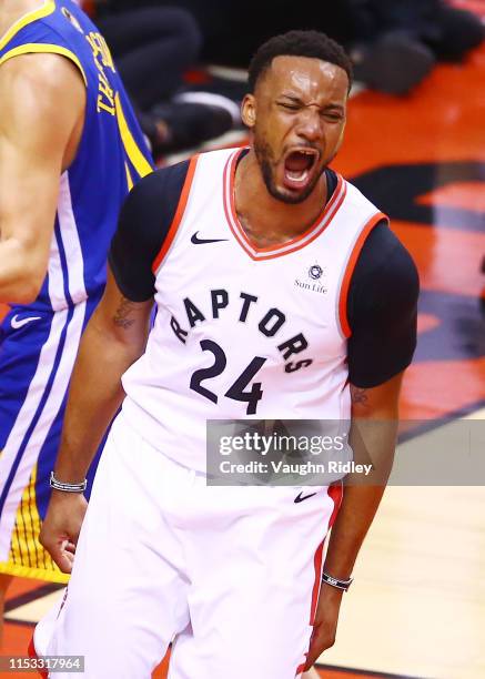 Norman Powell of the Toronto Raptors celebrates his dunk against the Golden State Warriors in the first half during Game Two of the 2019 NBA Finals...