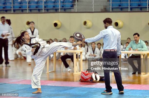 Student engages in Taekwondo during the sports trials for admission in the new academic year of Delhi University at Sports Complex, North Campus, on...