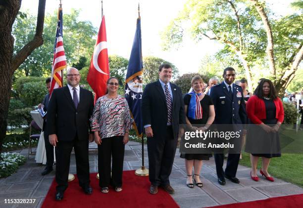 Charge dAffaires at the U.S. Embassy in Ankara Jeffrey M. Hovenier and his wife Laura Hovenier pose for a photo with officials as he holds a...
