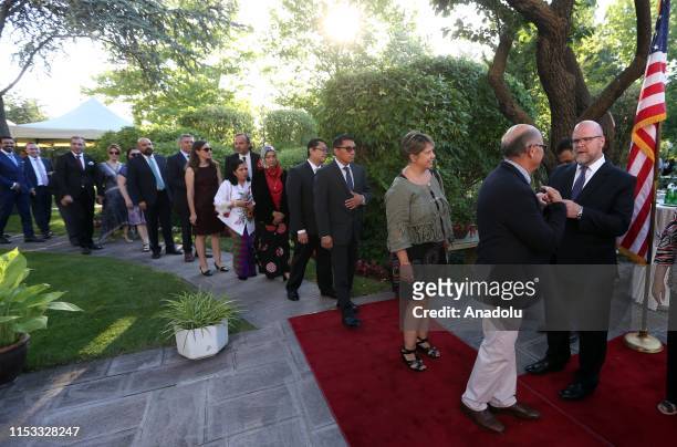 Charge dAffaires at the U.S. Embassy in Ankara Jeffrey M. Hovenier and his wife Laura Hovenier welcome people as they hold a reception for the 243rd...