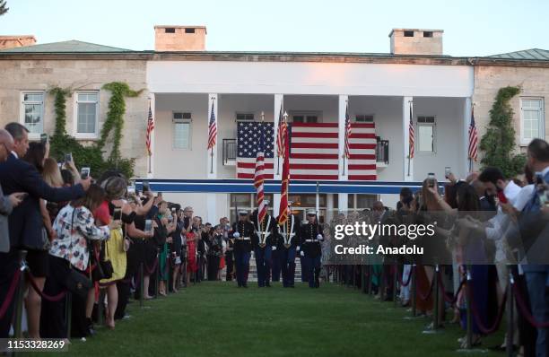 Military officers perform during a reception that held by Charge dAffaires at the U.S. Embassy in Ankara Jeffrey M. Hovenier and his wife Laura...