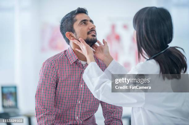 medical consulation - throat exam stock pictures, royalty-free photos & images