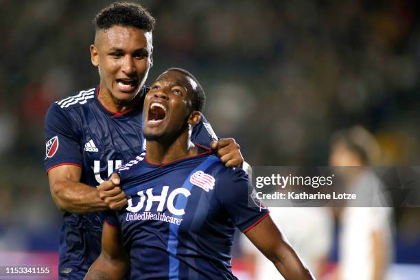 Juan Agudelo of New England Revolution and Cristian Penilla of New England Revolution celebrate Penilla's goal during the first half against the Los...