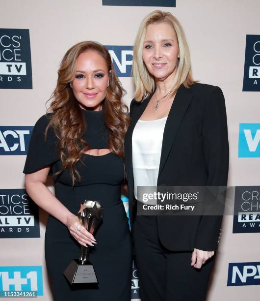 Leah Remini, recipient of the Impact Award, and Lisa Kudrow pose in the press room during the Critics' Choice Real TV Awards at The Beverly Hilton...