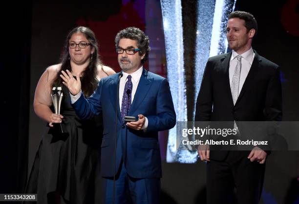 Sara Enright, Joe Berlinger, and Sam Broadwin accept the Best Crime/Justice Show award for 'Conversations with a Killer: The Ted Bundy Tapes' onstage...