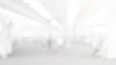 abstract blur soft focus white color interior of modern cleaning workplace background with shine light for design